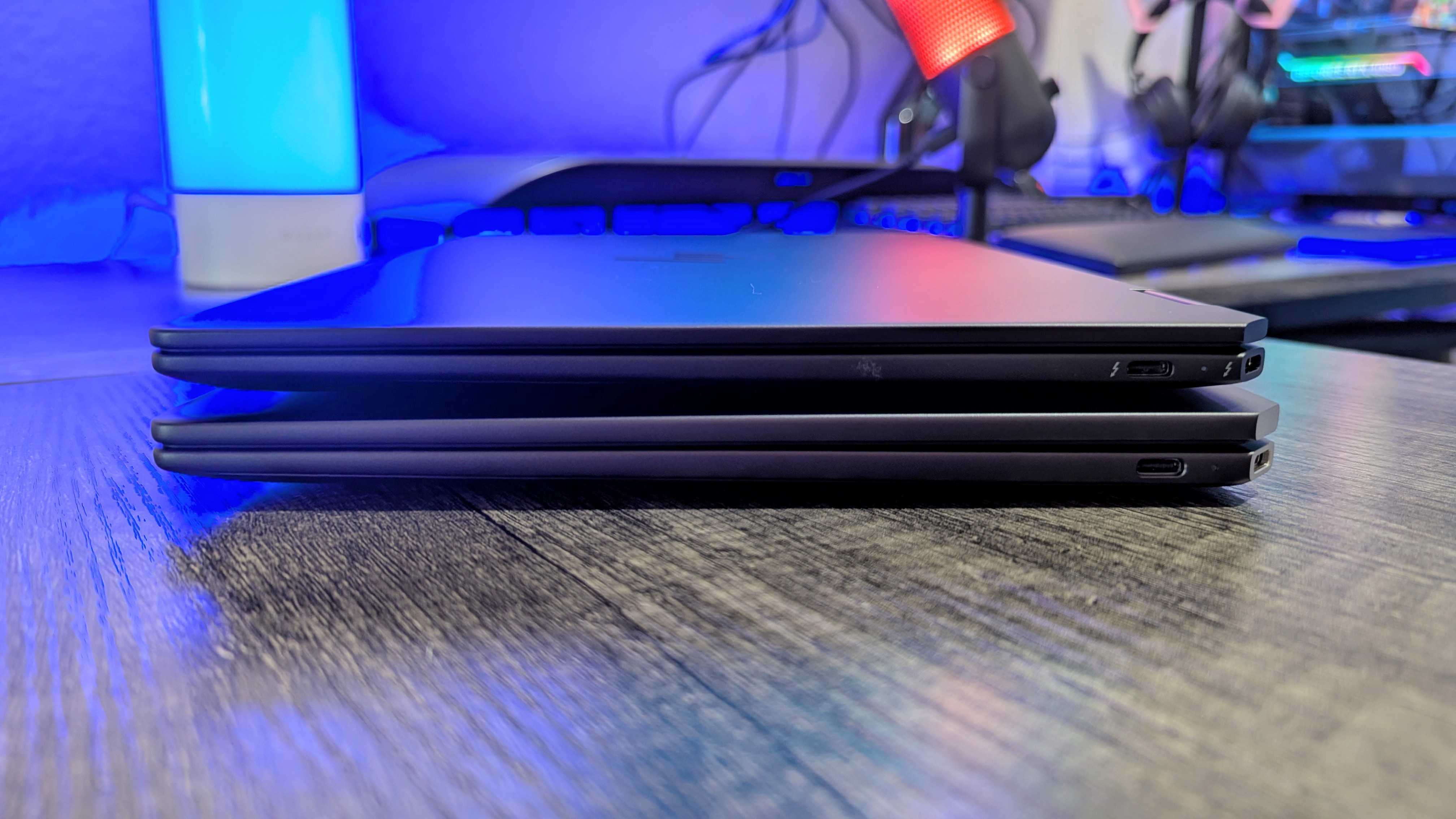 The HP OmniBook Ultra Flip 14 (2024) on top of the HP Spectre x360 14 (2024), showing the 2 USB Type-C Thunderbolt 4 ports.