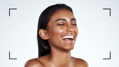 A woman smiling with clear skin after learning how to get rid of acne scars