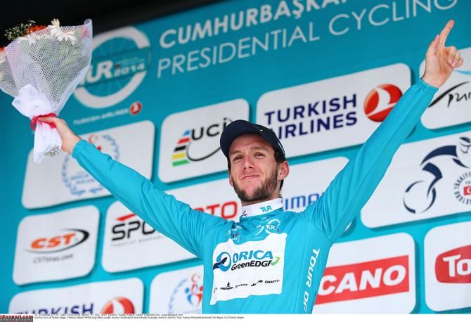 Race leader Adam Yates on the podium