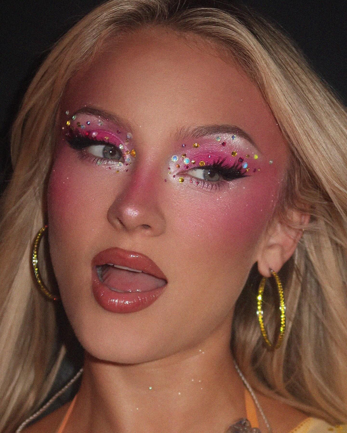 An image of Zara Larsson with pink bejeweled makeup.