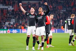 Arsenal's Declan Rice and Gabriel celebrate at full-time after their side's 7-1 Champions League last 16 first leg win over PSV at the Phillips Stadion in Eindhoven, Netherlands on 4 March, 2025