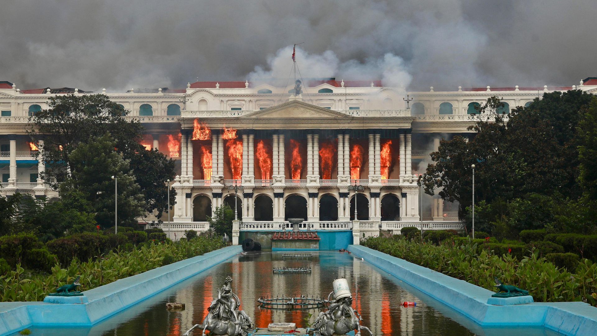 
                                Flames engulf the Singha Durbar palace, Nepal’s main administrative building, after days of anti-government protests in Kathmandu
                            