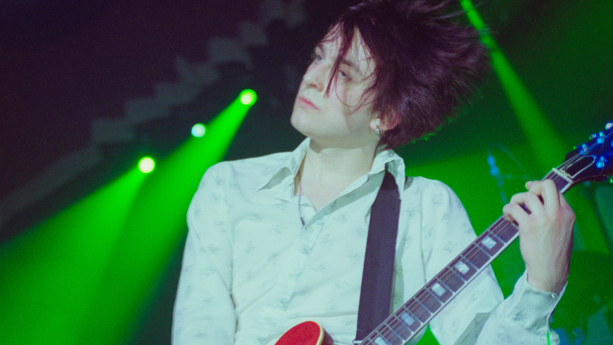 English musician and guitarist Richard Oakes of rock group Suede performs live on stage with the band at Kilburn National Ballroom in London on 11th October 1996.