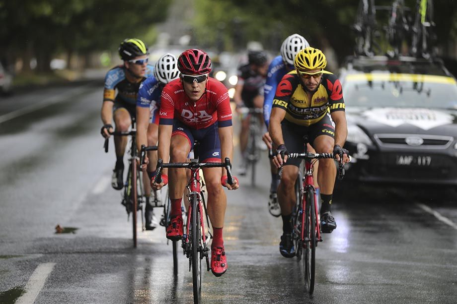 Adam Phelan leading the break on wet roads