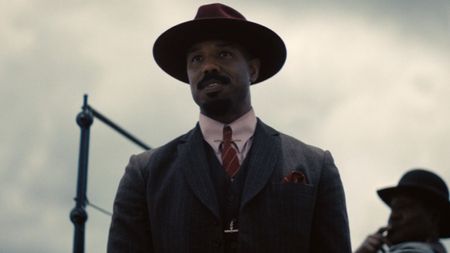 Elias "Stack" Moore (Michael B. Jordan) talks to Cornbread in Sinners.