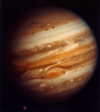 Voyager 1 captured this image of Jupiter and its moon Ganymede (bottom left) when it was just over a month away from its closest approach to the planet in 1979.