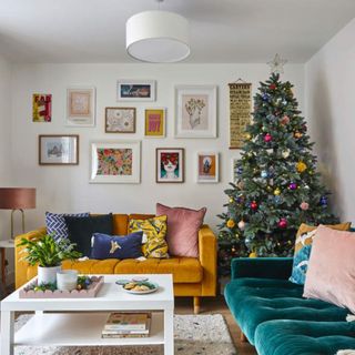 A Christmas tree decorated with brightly coloured baubles in a modern living room