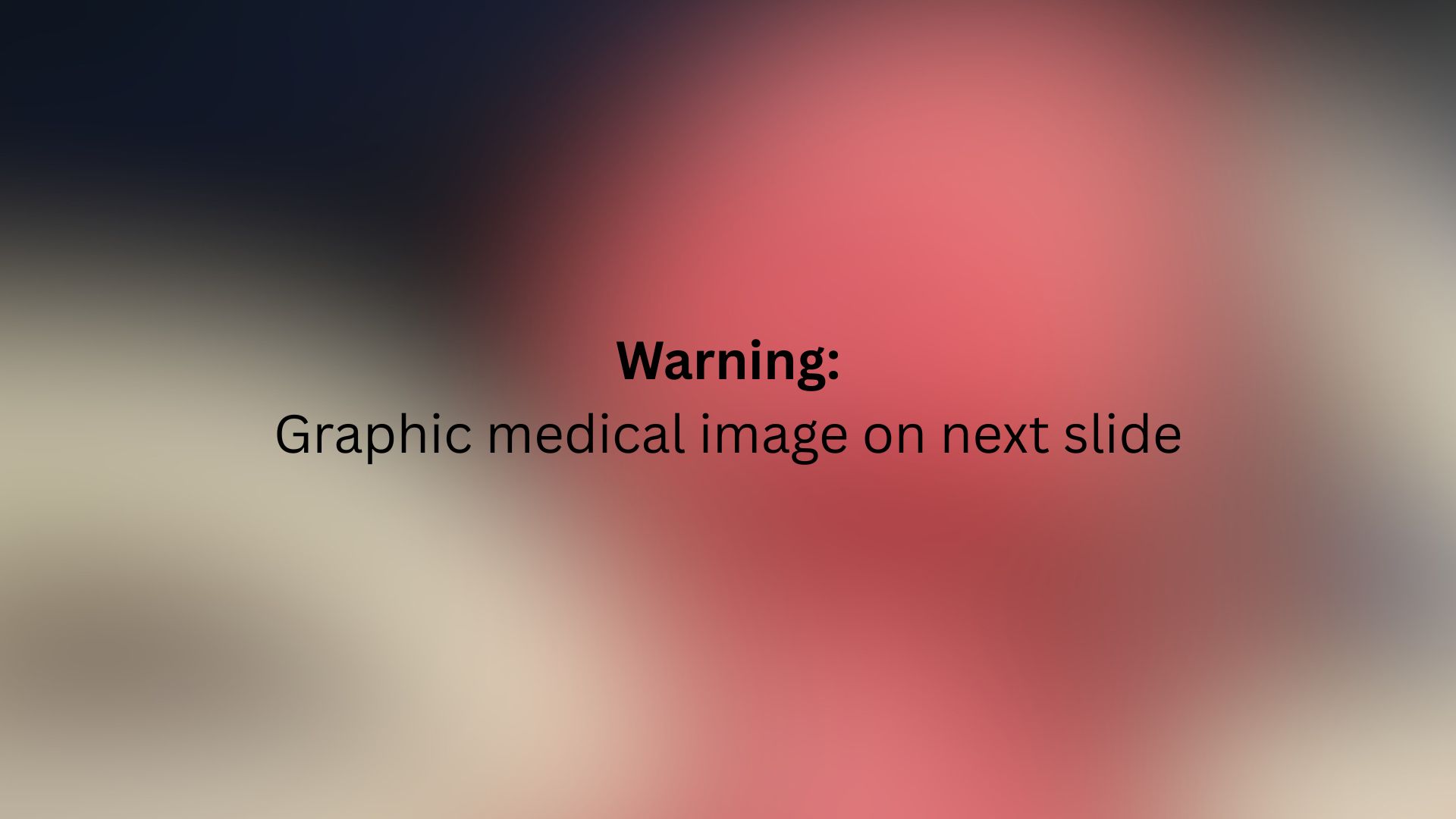Text reads: Warning: Graphic medical image on next slide