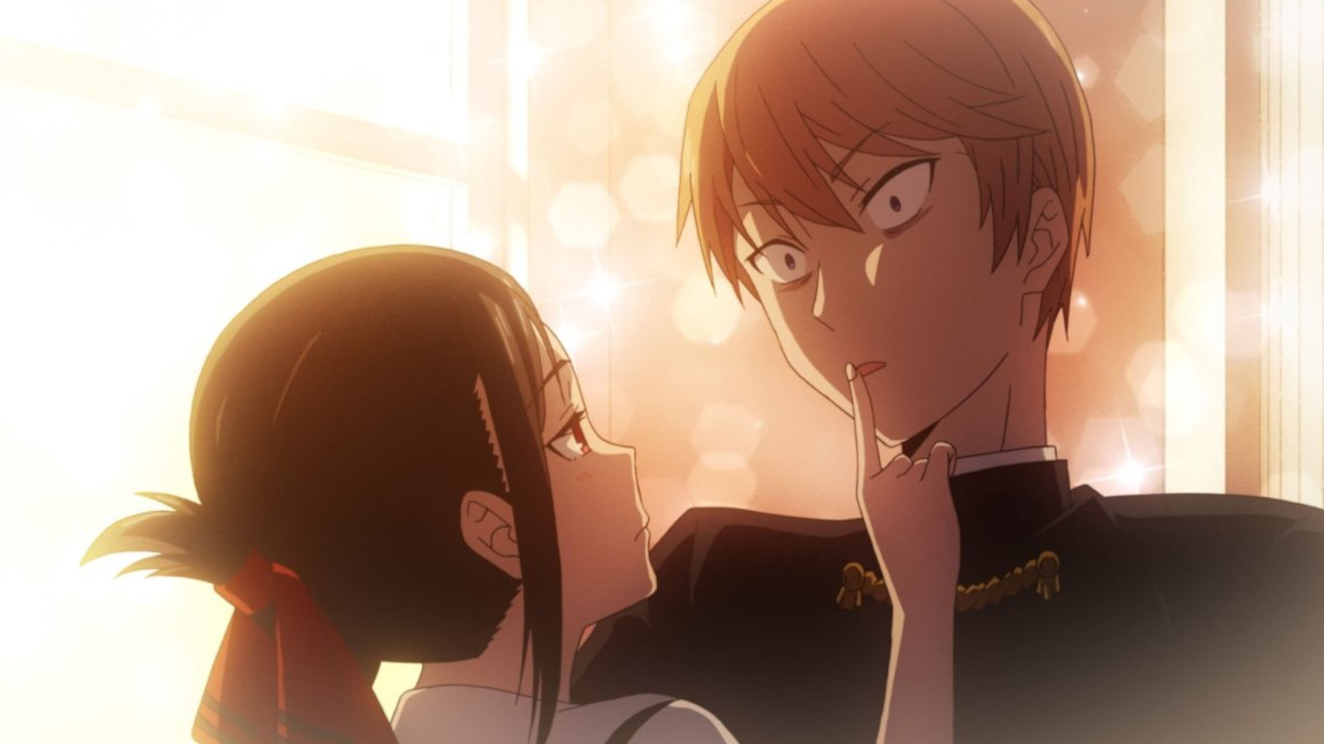 Kaguya Shinomiya holds a finger to Miyuki Shirogane's lips while he looks surprised during an episode of the romance anime Kaguya-sama: Love Is War.