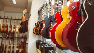 Guitar store wall of guitars
