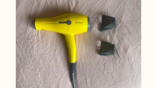 The Drybar Buttercup Hair Dryer and its attachments