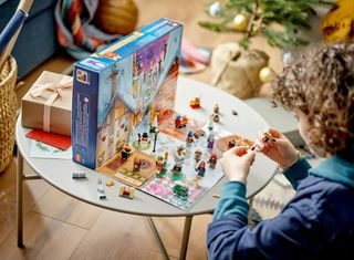 The LEGO Harry Potter Advent Calendar being played with by a little boy