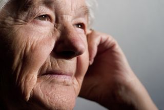 An older person's face. 