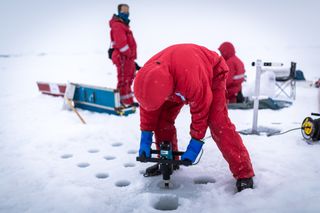 Alfred Wegener Institute researchers take ice samples during a 2017 expedition on the icebreaker Polarstern