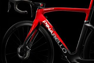 Image shows frame detail of the Pinarello F road bike in a red colour scheme