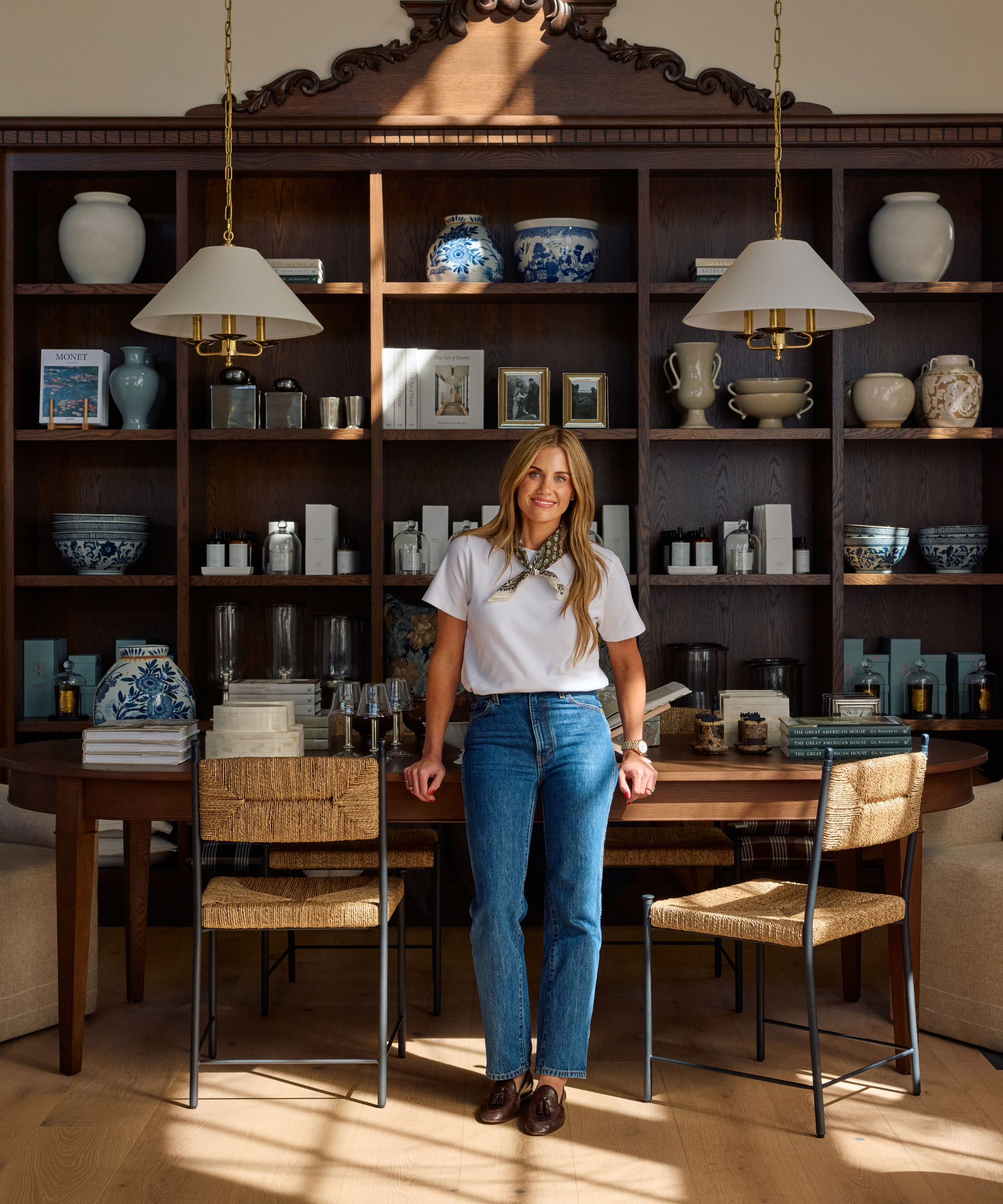 Shea McGee poses inside her newly opened McGee &amp;amp; Co flagship in Salt Lake City, which is styled with a mix of new and vintage decor.