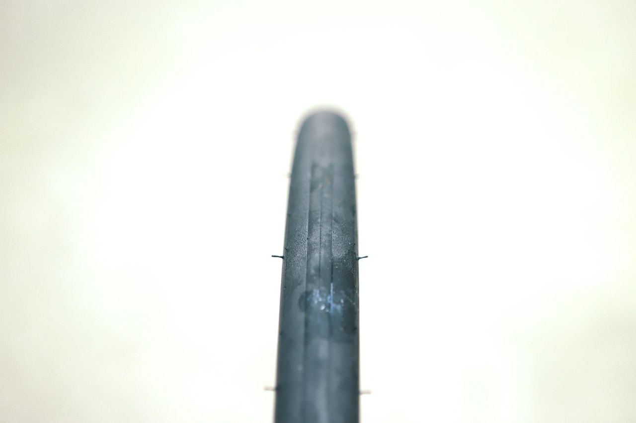 a close up of a black road bike tyre