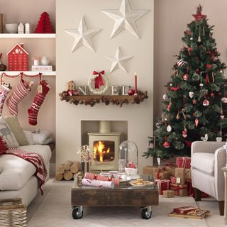 Living room with festively decorated christmas tree and hanging stockings