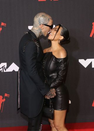 Travis Barker and Kourtney Kardashian attend the 2021 MTV Video Music Awards in 2021