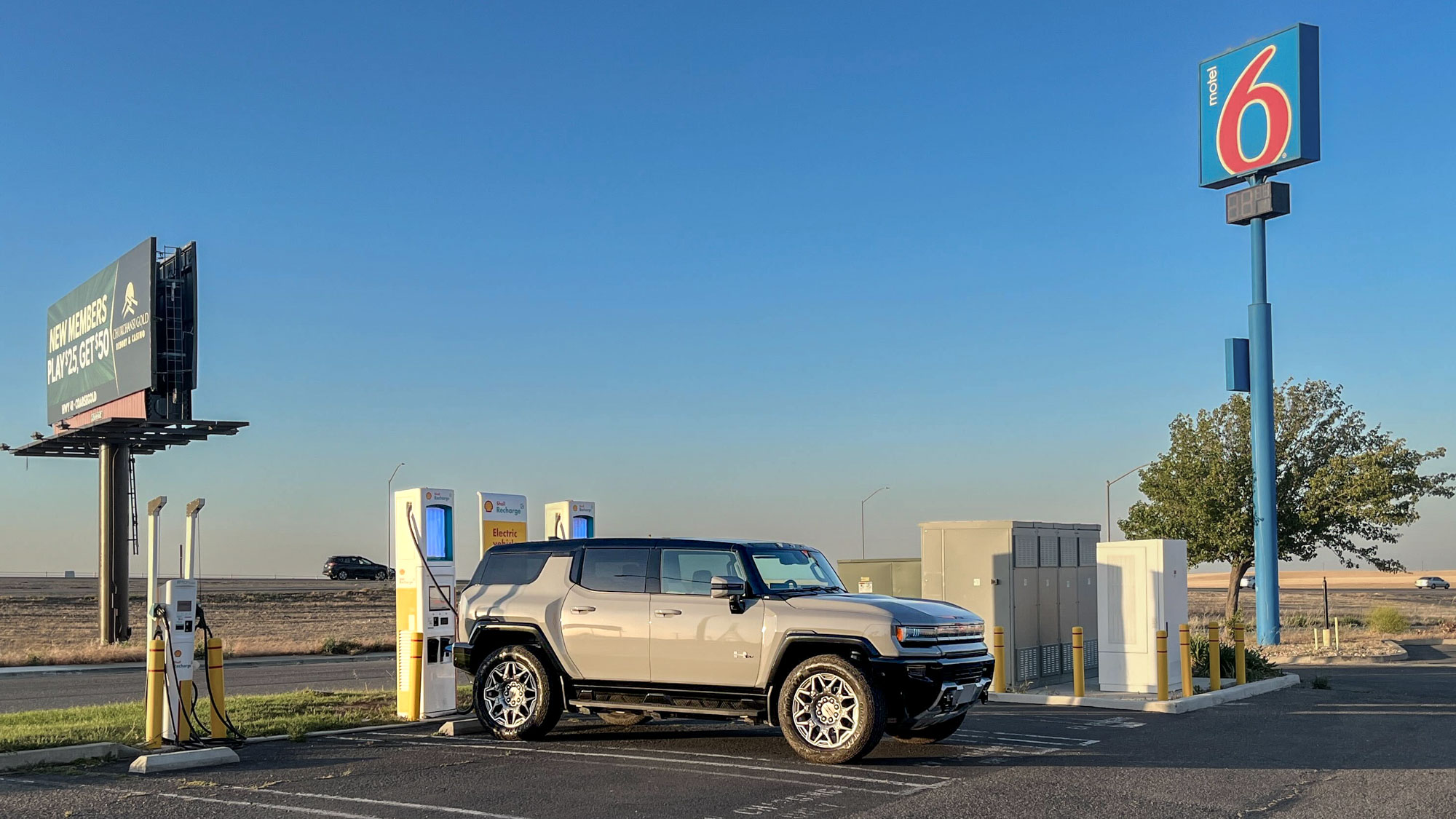 2025 GMC Hummer EV 3X SUV parked at a charging station