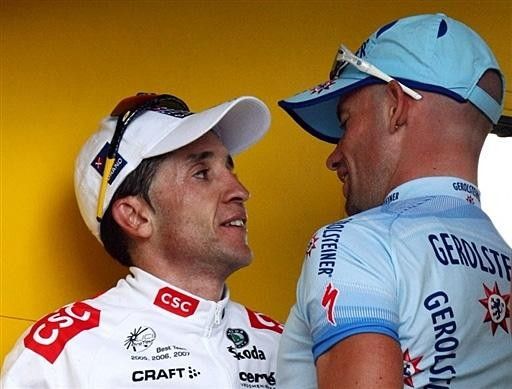 Stage winner Stefan Schumacher congratulates Carlos Sastre during the podium ceremony.