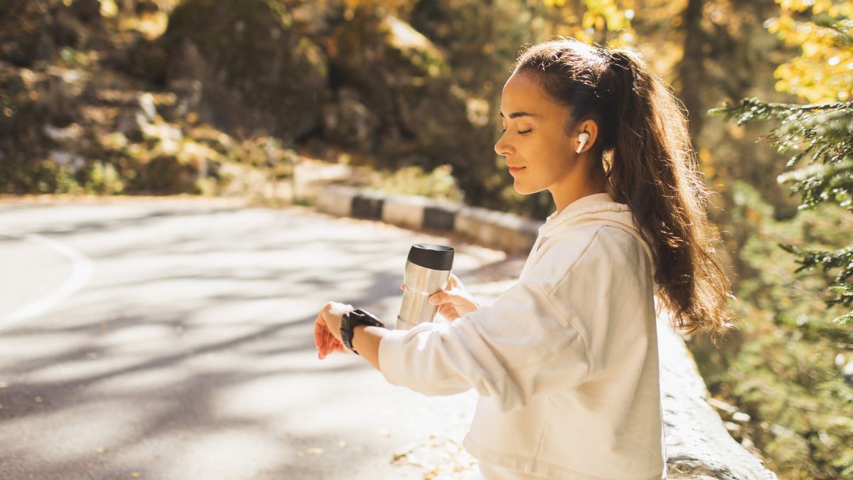 Woman checking GPS sports watch