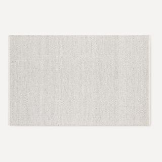 Burrow Cape House Indoor/Outdoor Rug against a white background.