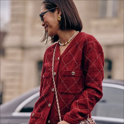 Aimee song in a red chanel cardigan during spring/summer 24 fashion week 