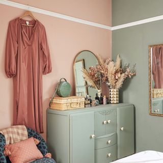 Dressing table in bedroom with sage and pink painted walls