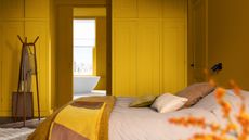 yellow color drenched bedroom