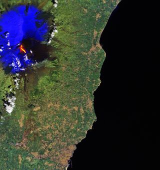 This image of lava flowing from Mount Etna was captured on March 16, 2017 by the European Space Agency’s Sentinel-2A satellite. Etna’s snow has been processed in blue to distinguish from the clouds.