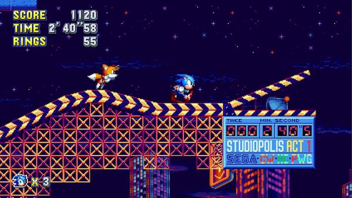 Sonic Mania running on the PS4 shows the vibrant pixelated graphics of a colorful stage that Sonic and Tails run across