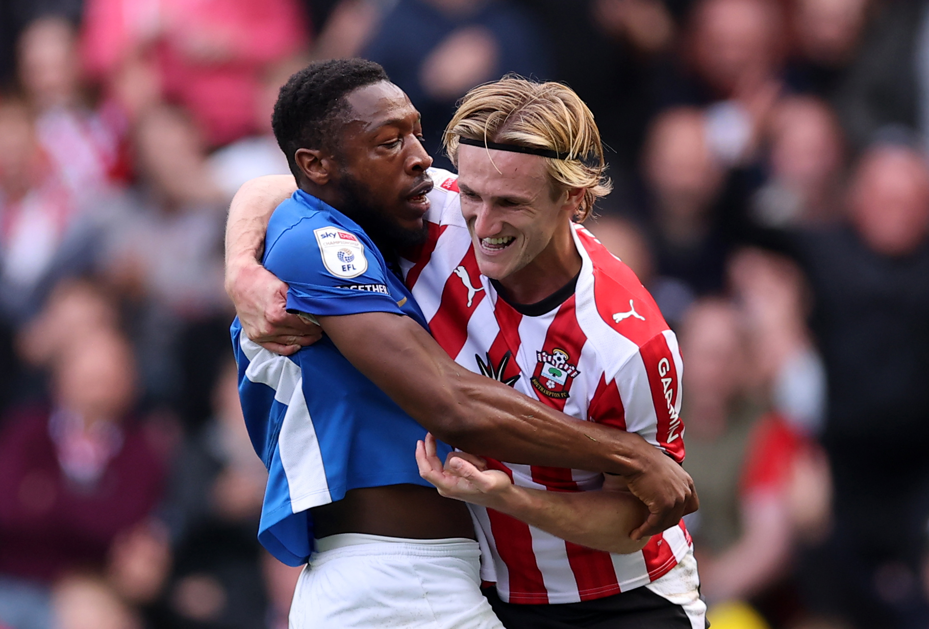 SOUTHAMPTON, ENGLAND - OCTOBER 11: Flynn Downes of Southampton and Ebou Adams of Portsmouth clash during the Sky Bet Championship 2026/27 match between Southampton and Portsmouth at St Mary&amp;amp;apos;s Stadium on October 11, 2026 in Southampton, England. (Photo by Warren Little/Getty Images)