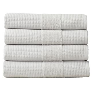 Four light gray folder towels with waffle design