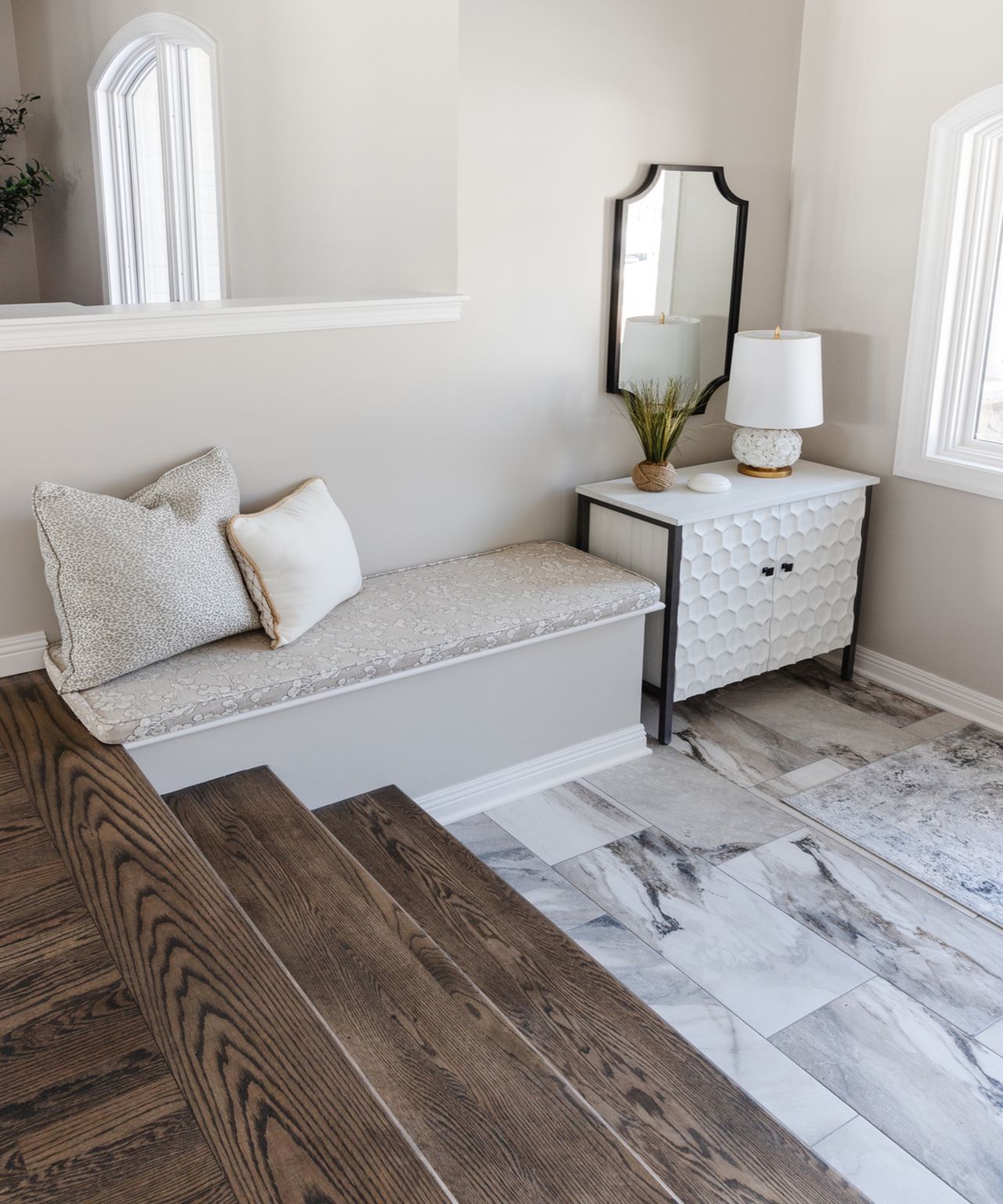 White entryway with furniture