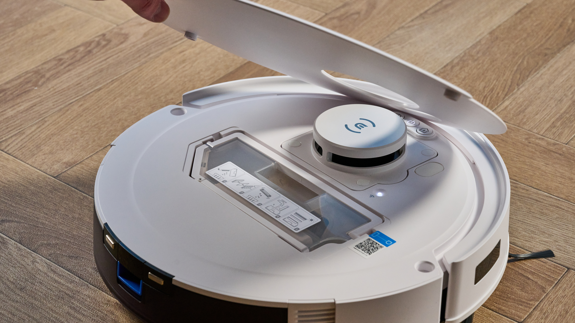 Ecovacs Deebot N20 in white photographed vacuuming floor