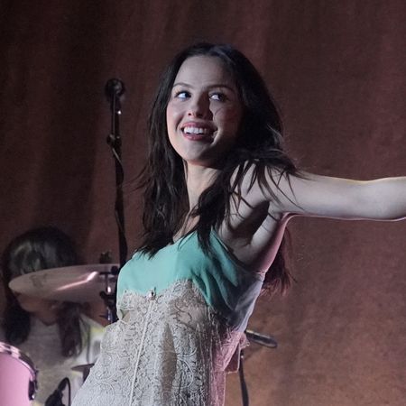 Olivia Rodrigo wearing a babydoll vintage dress on Saturday Night Live and performing Drop Dead