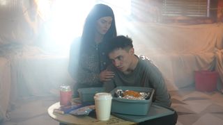 Mercedes holds Bobby as they hide in The Dog.