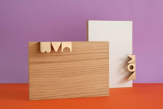 Design Hooks by Adam Nathaniel Furman in brass mounted on white and wooden doors