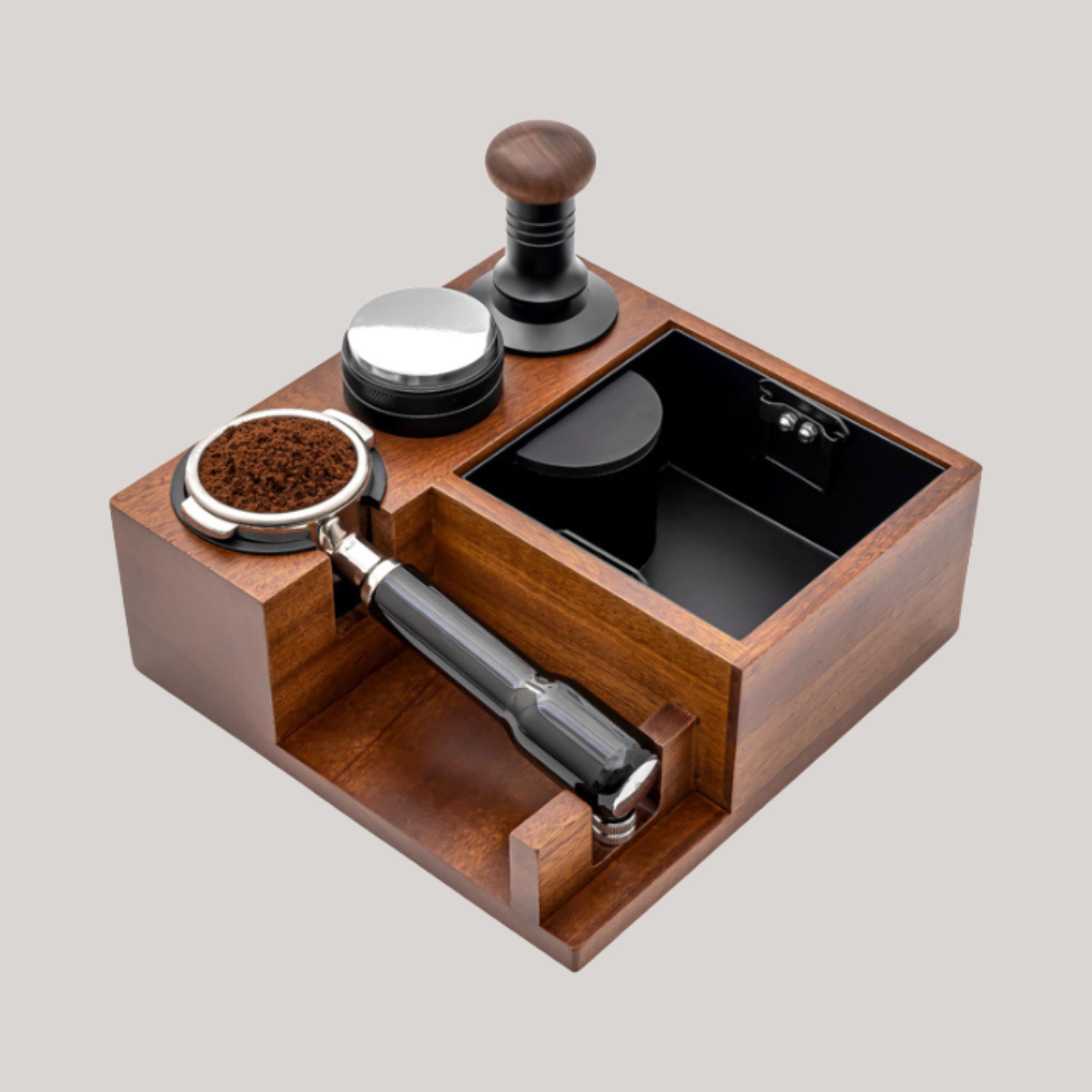 Tamper Stand With Integrated Coffee Knock Box in light wood set against pale gray background.