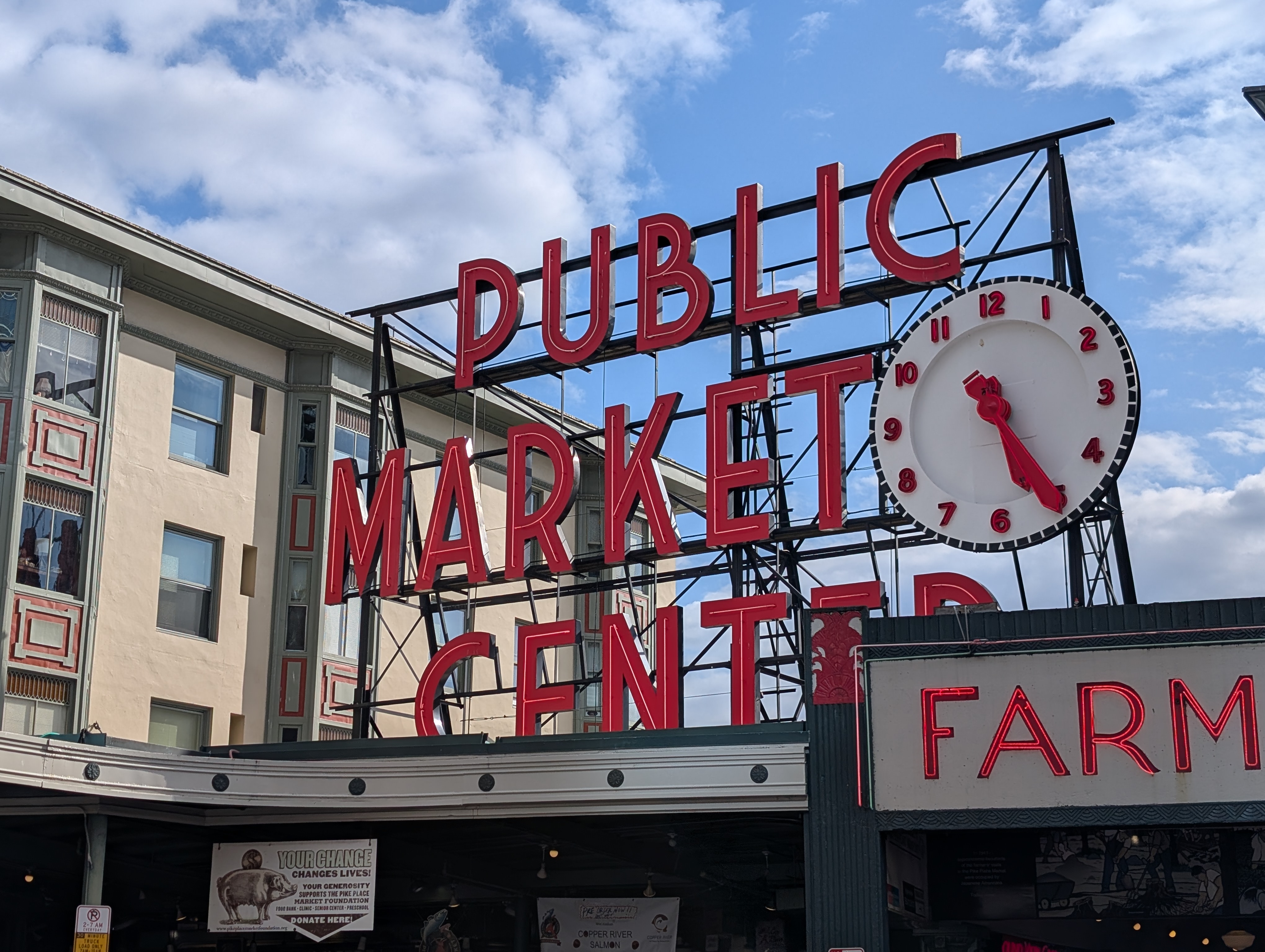 A red Public Market Center sign