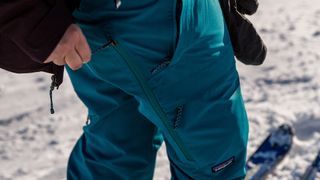 A close-up on the thigh of a woman wearing a pair of Patagonia Women’s Storm Shift Pants.