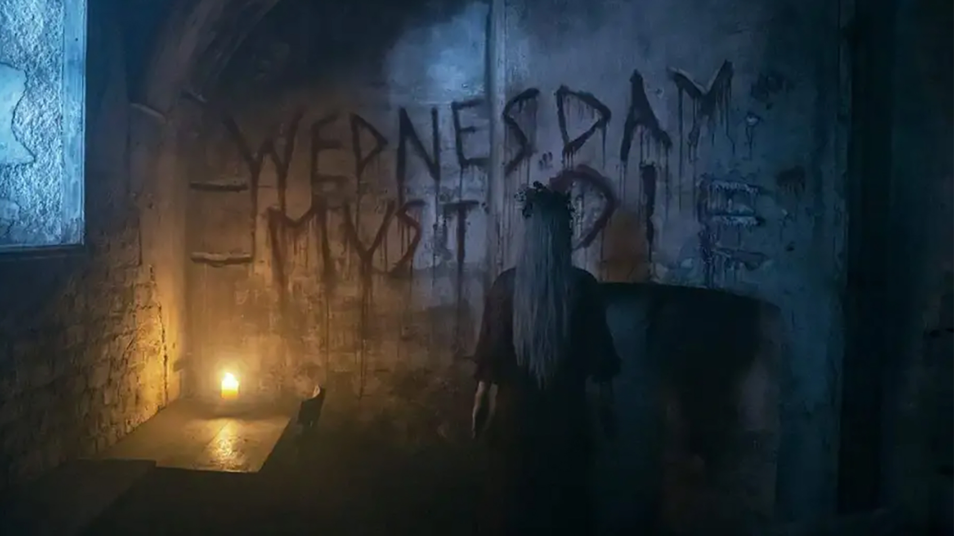 Aunt Ophelia seen only from behind, scrawling "Wednesday must die" on the wall in blood