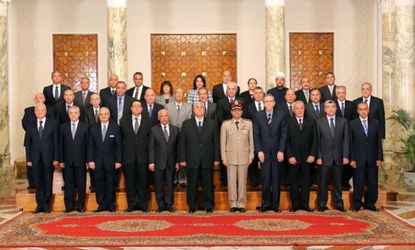 Interim President Adly Mansour (center) and his newly elected cabinet, which included three women.
