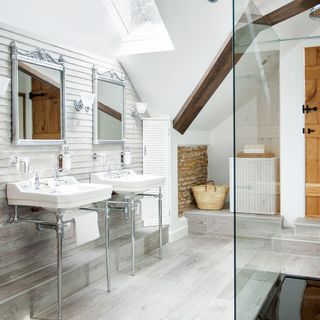 White bathroom with wood panelled wall