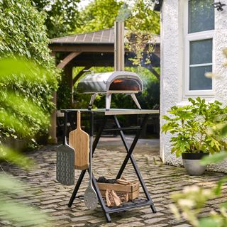 Ooni pizza oven on stand.