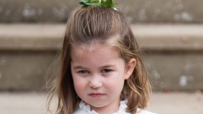 Princess Charlotte of Cambridge attends the wedding of Princess Eugenie of York and Jack Brooksbank at St George's Chapel in Windsor Castle