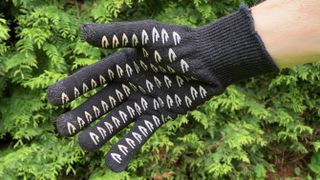 Black cycling gloves on hands