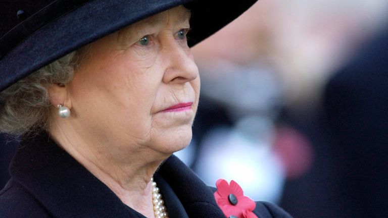 Queen Elizabeth II Wearing A Black Outfit For Mourning With Red Poppies And A Sad Expression Visiting The Field Of Remembrance At Westminster Abbey Commemorating The War Dead .