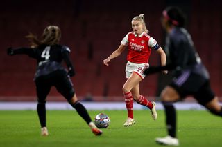 Leah Williamson of Arsenal advances wit the ball during the UEFA Women's Champions League group C match between Arsenal and Olympique Lyon at Emirates Stadium on December 15, 2022 in London, England.